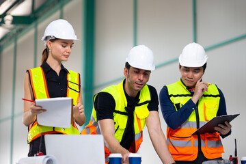 automated smart warehouse. Ethnic diversity worker people, Success teamwork. Group of professional engineering people wearing hardhat safety helmet meeting with solar photovoltaic