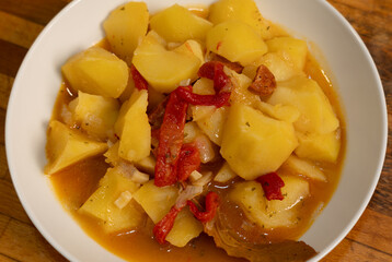 Closeup of a traditional potatoes, pepper and chorizo dish. Rioja style potatoes. Spainish food