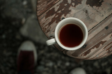 warm coffee on an old wooden table