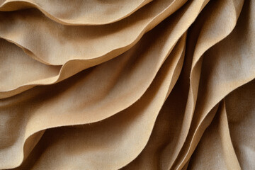 Fototapeta premium A delicate mocha mousse background featuring smooth folds of light brown and caramel hues.