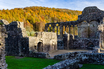 Ruins of Tintern Abbey and spectacular autumn foliage behind