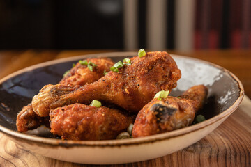 Chicken Wings and Legs on a Plate at a Restaurant