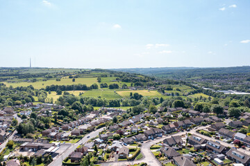 Aerial drone photo of the village of Kirkheaton, Huddersfield in the Kirklees district in the county of West Yorkshire England showing the village and River Calder from above in the summer time.