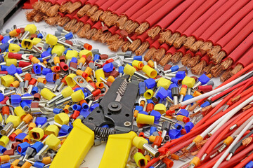 Obraz premium Electrical installation tools and materials for the assembly of electrical equipment. Soft focus. Close-up.
