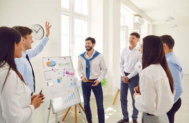 Successful business people on flip charts presentation of new project in boardroom at company...