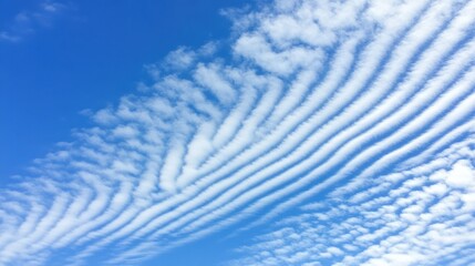 Obraz premium Textured Cloud Formation Across a Bright Blue Sky During Daylight Hours