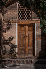 old decorated wooden door, Madrassa entrance