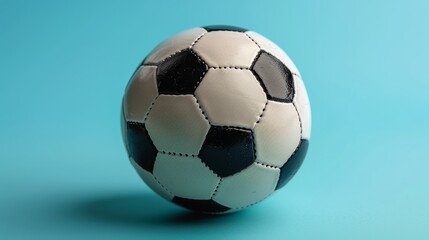 Fototapeta premium Classic Soccer Ball on Blue Background Sports Equipment Photography for Editorial Use