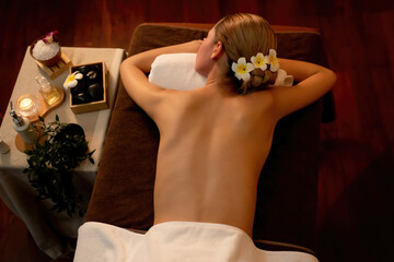 Top view woman customer enjoying relaxing anti-stress spa massage and pampering with beauty skin...