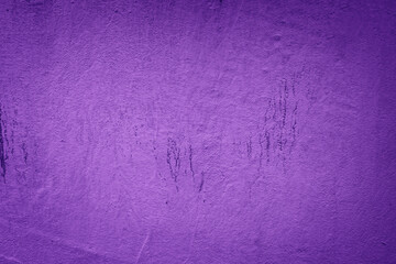 An old, textured wall with a grungy, vintage appearance, featuring a cracked surface in  dark purple tone