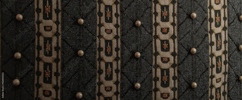 Aufkleber a black and white striped carpet with a pattern of circles and squares. the carpet is made of wool a