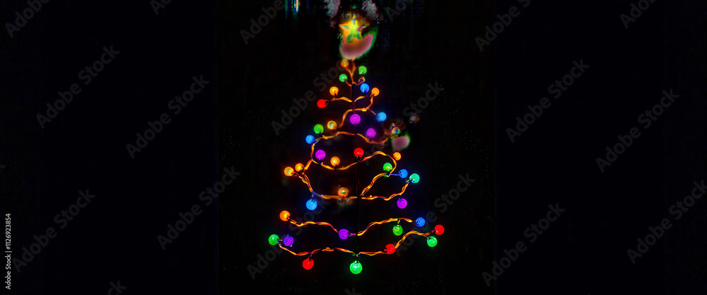 Poster a christmas tree made of lights is lit up in a dark room. the lights are arranged in a triangular sh