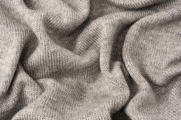 Grey wool sweater texture as a background.
