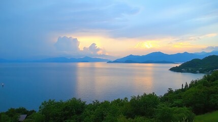 Serene Sunset Over Calm Lake with Mountains in the Background