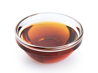 Sesame oil in a glass bowl isolated on white background. With clipping path.