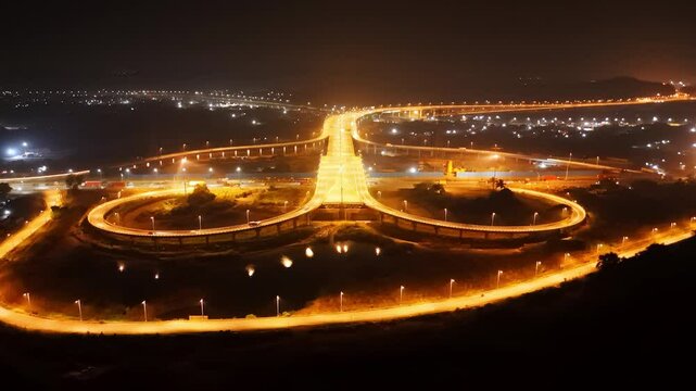 Aerial view of A well lit highway interchange at night