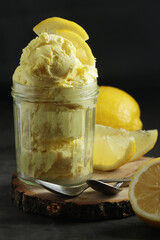 Lemon ice cream scoops in glass jar	