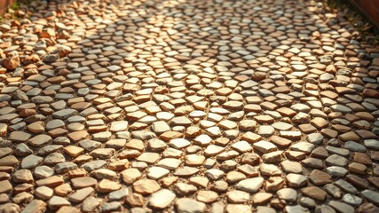 Naklejka premium Sunlit Pathway of Irregular Stone Tiles Creates a Textured Surface