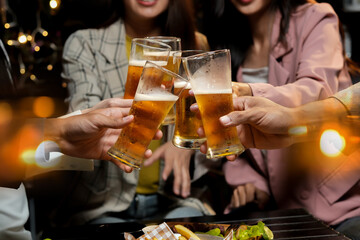 food and drink male friends are happy drinking beer and clinking glasses at a bar or pub.