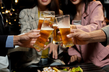 food and drink male friends are happy drinking beer and clinking glasses at a bar or pub.