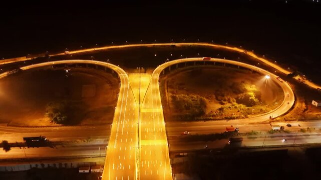 Aerial perspective of lit roads and roundabouts