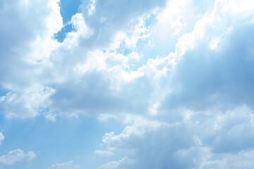 Bright Sunny Sky with Fluffy White Clouds Background