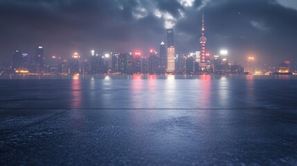 Fototapeta premium A nighttime cityscape with illuminated skyscrapers reflecting on a wet surface.