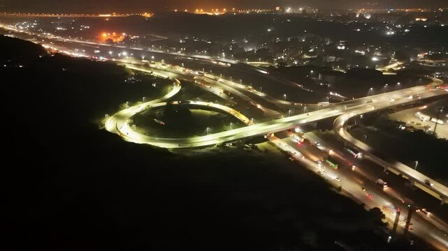 Aerial Night View of Busy Highway Interchange