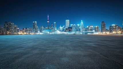 Obraz premium A nighttime cityscape featuring illuminated skyscrapers and a clear sky.