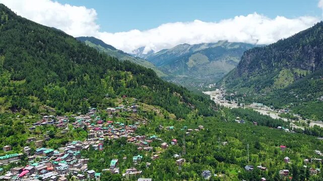 Aerial view of manali with the beas river in himachal pradesh India. Himalayan mountains and colourful local houses nestled in the hills of manali himachal pradesh India.