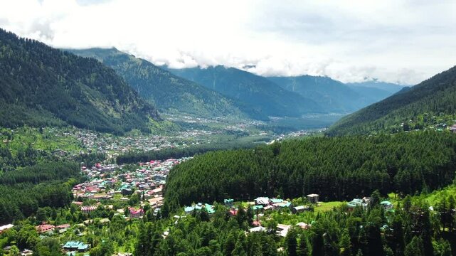 Aerial view of manali with the beas river in himachal pradesh India. Himalayan mountains and colourful local houses nestled in the hills of manali himachal pradesh India.