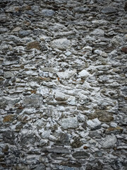 Old stone wall showing deterioration in chamonix, french alps November