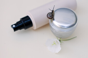 bottle for skin care. cream with snail skin care gel in glass jar close up. Beauty treatment product texture macro.