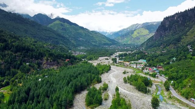 Aerial view of manali with the beas river in himachal pradesh India. Himalayan mountains and colourful local houses nestled in the hills of manali himachal pradesh India.