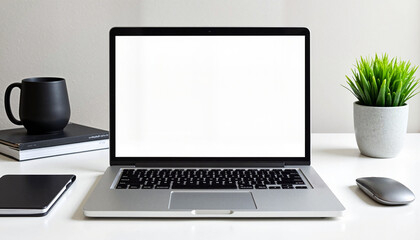 Laptop with blank screen on modern desk with plant and coffee mug
