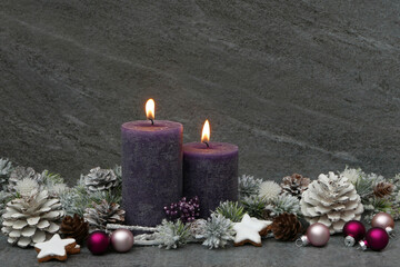 Christmas greeting card: candles with Christmas balls, a Santa Claus and the Spanish inscription Merry Christmas and a Happy New Year.