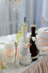 beautifully decorated champagne bottles at a wedding banquet