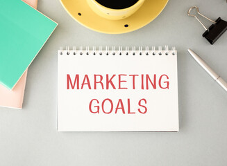 Notebook with Toolls and Notes about Marketing Goals