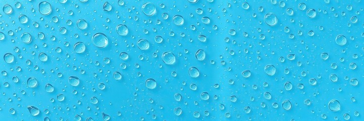 Clear water droplets on vibrant blue background creating a refreshing and calming visual, pattern, detail, close-up