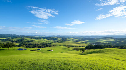 Obraz premium serene rural landscape featuring rolling green hills, distant mountains, and clear blue sky. peaceful scenery evokes sense of tranquility and natural beauty