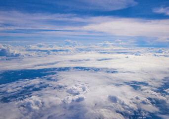 Cloudscape, Colored Clouds at Sunset near the Ocean. View from Plane