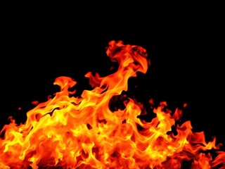 Fire flames on black background with vibrant colors and dynamic motion, energy, danger