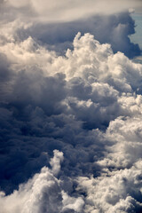 Cloudscape, Colored Clouds at Sunset near the Ocean. View from Plane