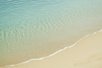 serene minimalistic beach background with soft sand and clear blue water evoking peace and relaxation