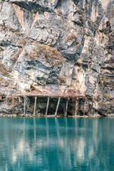 Tranquility beautiful view of the colorful turquoise lake and limestone rock cliff at the Jiuzhaigou valley, the Unesco world heritage site of Sichun China. Nature and outdoor scape photo.
