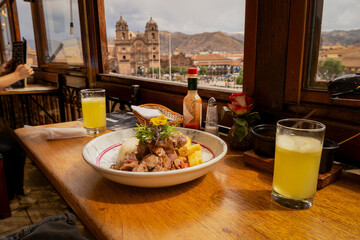 Alpaca loin with mushroom cream overlooking the Cusco square, Peruvian food