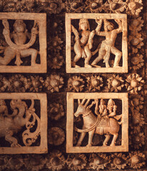 Ancient people in dance, design on ceiling of abandoned historical temple,  India.