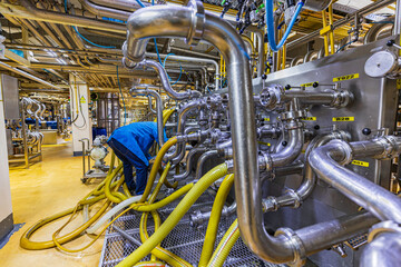 Male workers control Industrial automation factory chemical equipment pipe stainless