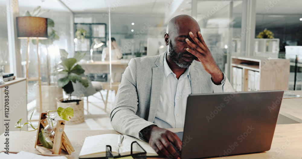 Poster burnout, laptop and stress with business black man at desk in office for audit or tax deadline. comp