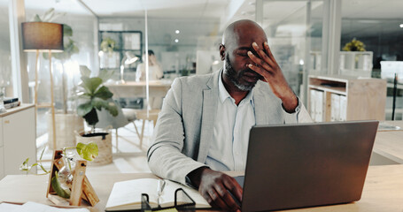 Burnout, laptop and stress with business black man at desk in office for audit or tax deadline....
